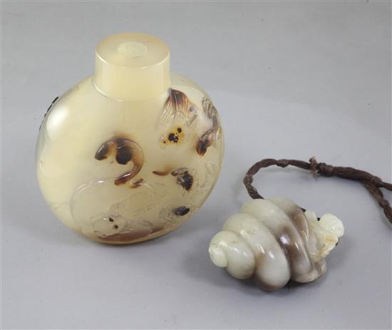 A Chinese pale celadon and brown jade carving and a shadow agate snuff bottle, late 19th/early 20th century, height 6.7cm